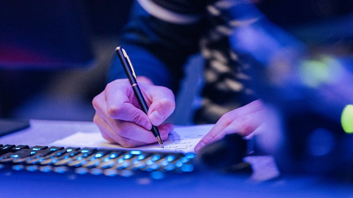  someone writing down in a notebook